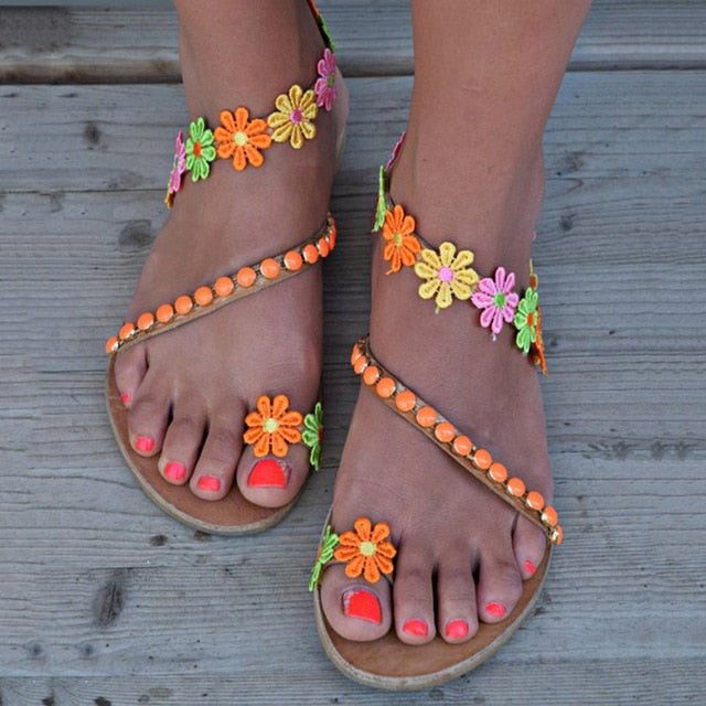 Women's Bohemian Style Summer Sandals with flower accents in various colors and styles.