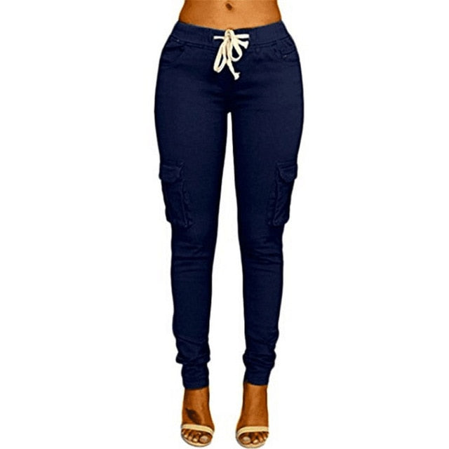 A woman wearing High Waist Jogger Pants in black color with pockets, elastic waistband and drawstring closure