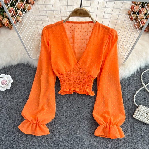 Stylish Long Sleeve Crop Top with polka dot pattern made of silk, cotton, and spandex. Comes with a matching attached tank top for versatile styling.