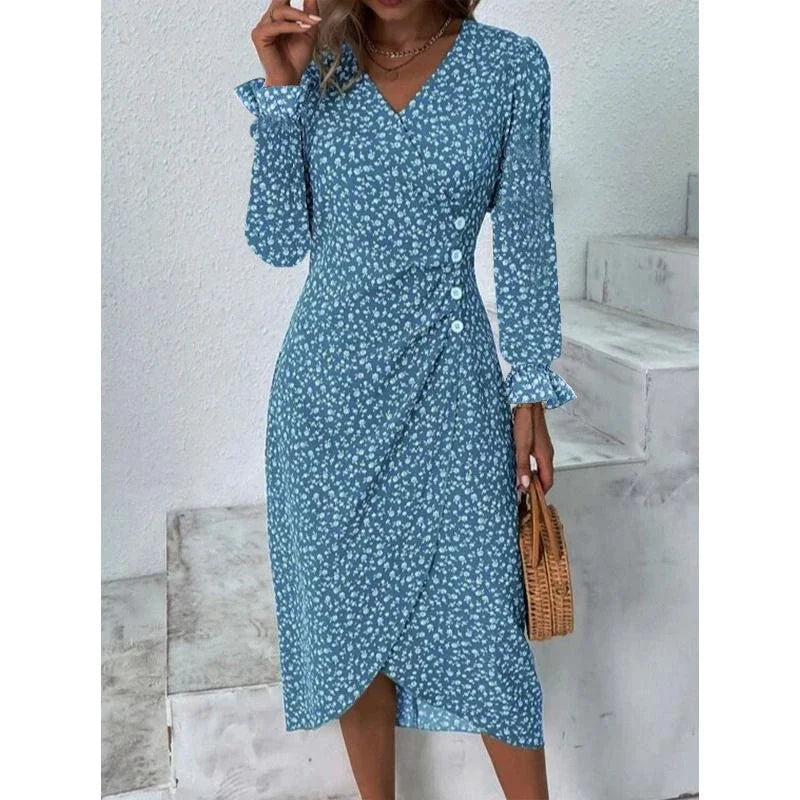 Woman wearing an elegant floral pleated V-neck midi dress with puff sleeves and button details – perfect summer outfit.