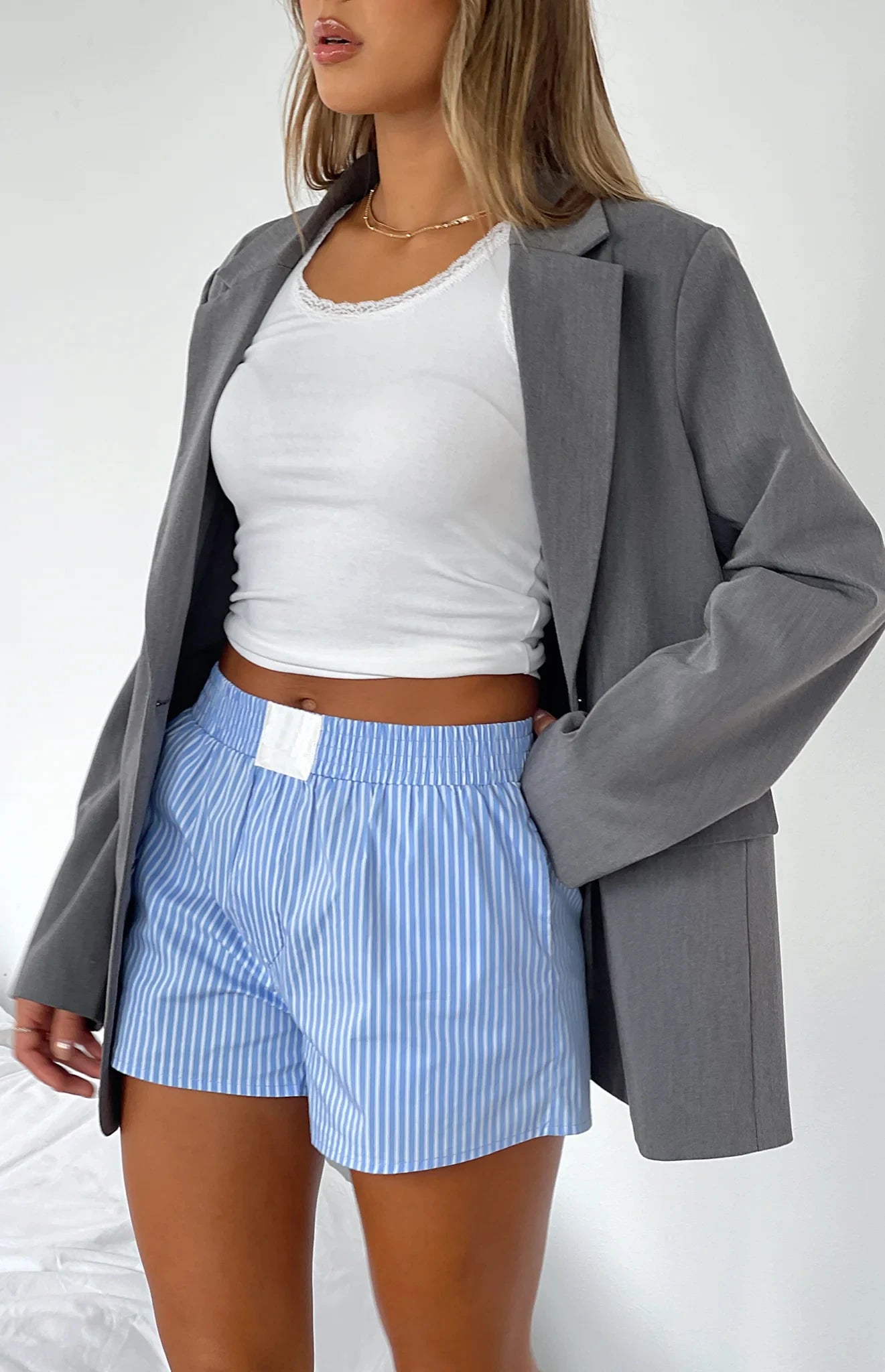 Loose High-Waist Casual Shorts made from cotton and polyester broadcloth with an elastic waist and solid pattern, perfect for summer casual wear.
