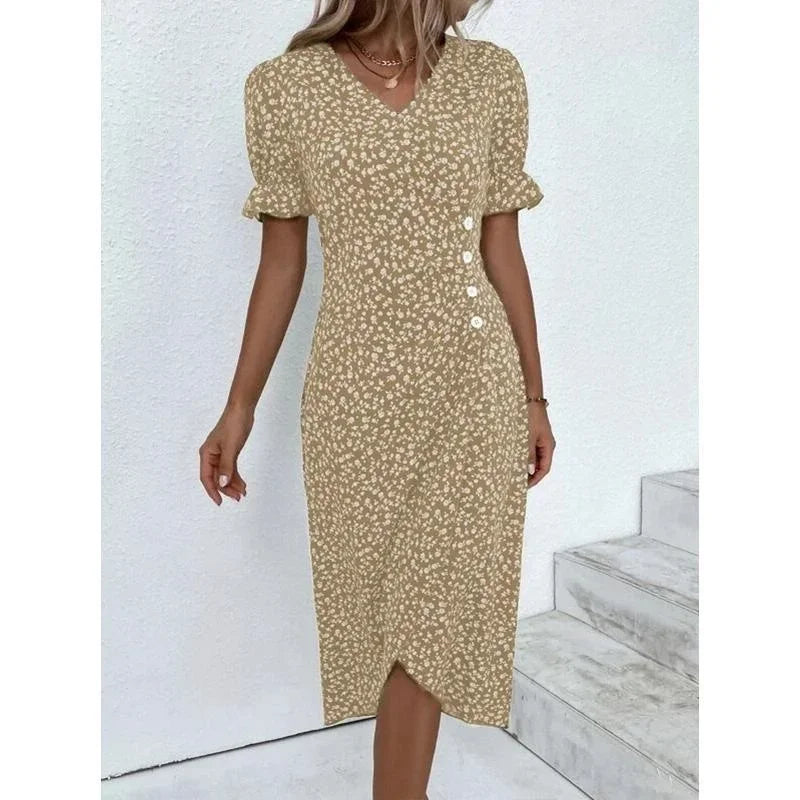Woman wearing an elegant floral pleated V-neck midi dress with puff sleeves and button details – perfect summer outfit.