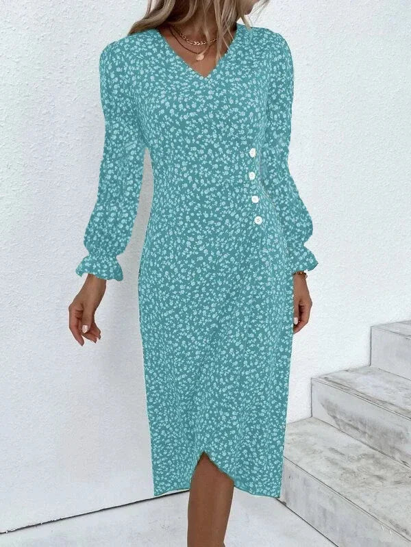Woman wearing an elegant floral pleated V-neck midi dress with puff sleeves and button details – perfect summer outfit.