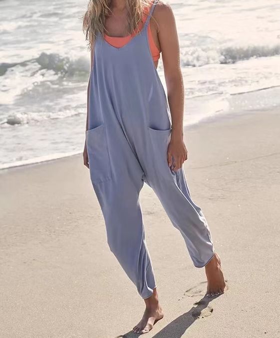 Women's Wide Leg Jumpsuit in solid patterns, loose fit, with pockets. Perfect for summer fashion. Available for women aged 18-24. Made from premium polyester fabric.
