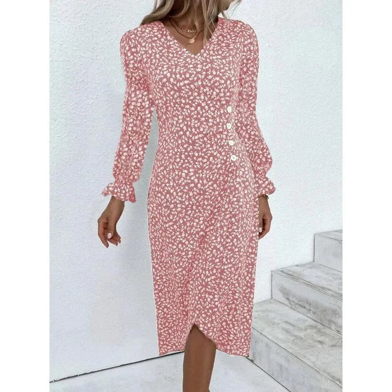 Woman wearing an elegant floral pleated V-neck midi dress with puff sleeves and button details – perfect summer outfit.
