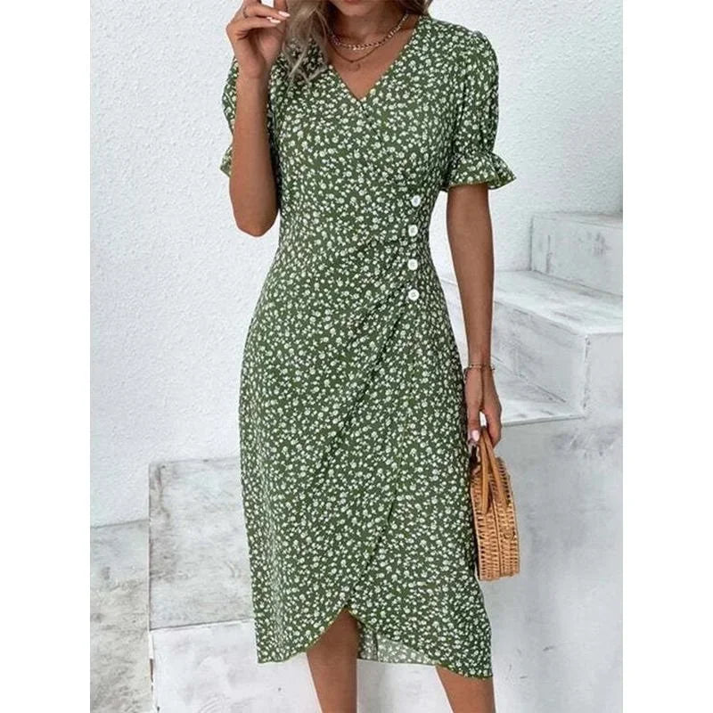Woman wearing an elegant floral pleated V-neck midi dress with puff sleeves and button details – perfect summer outfit.