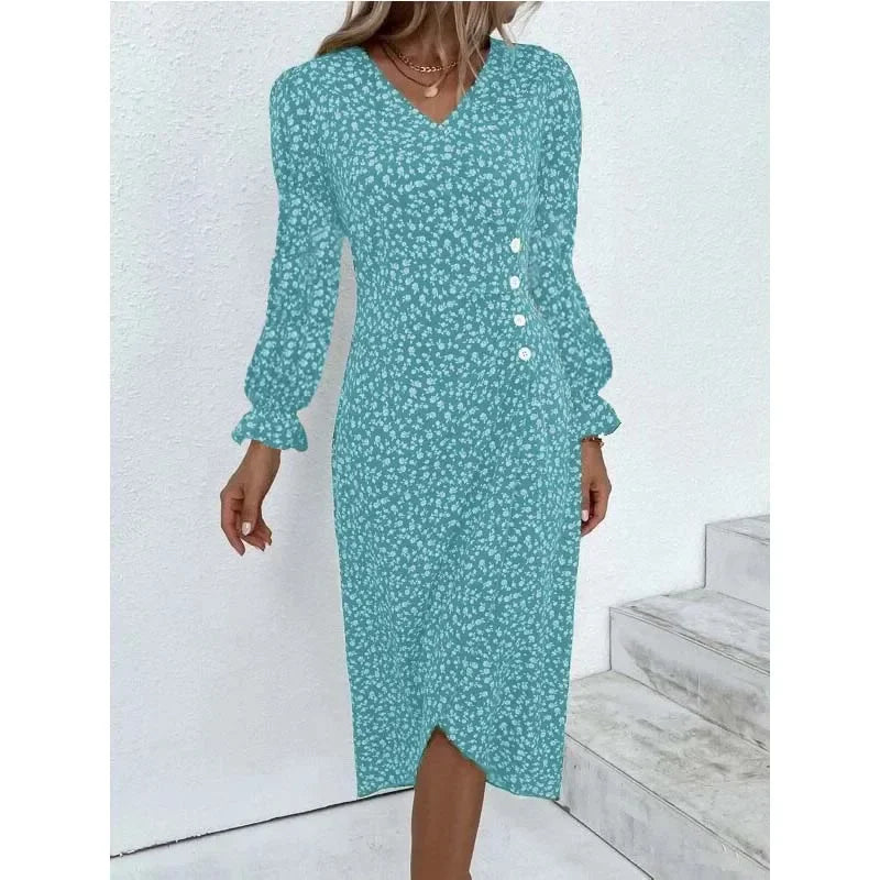 Woman wearing an elegant floral pleated V-neck midi dress with puff sleeves and button details – perfect summer outfit.