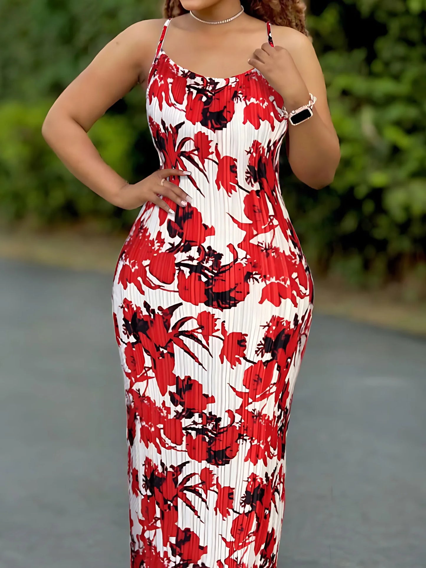 Woman wearing a colorful women's tie-dye spaghetti strap pleated bodycon dress with ankle-length slim fit – perfect for summer or beachwear.