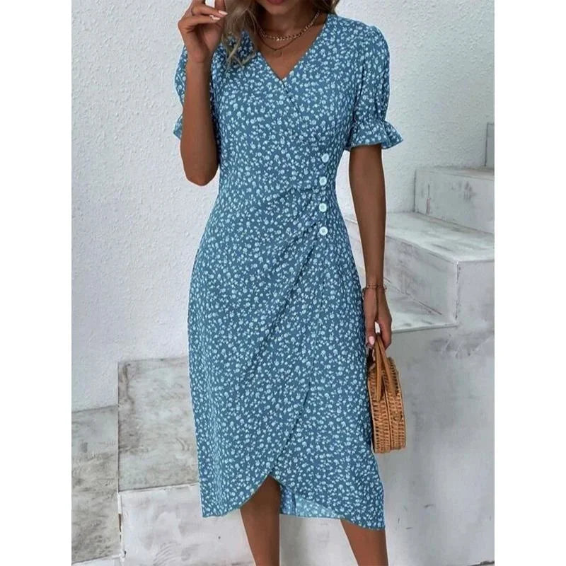 Woman wearing an elegant floral pleated V-neck midi dress with puff sleeves and button details – perfect summer outfit.