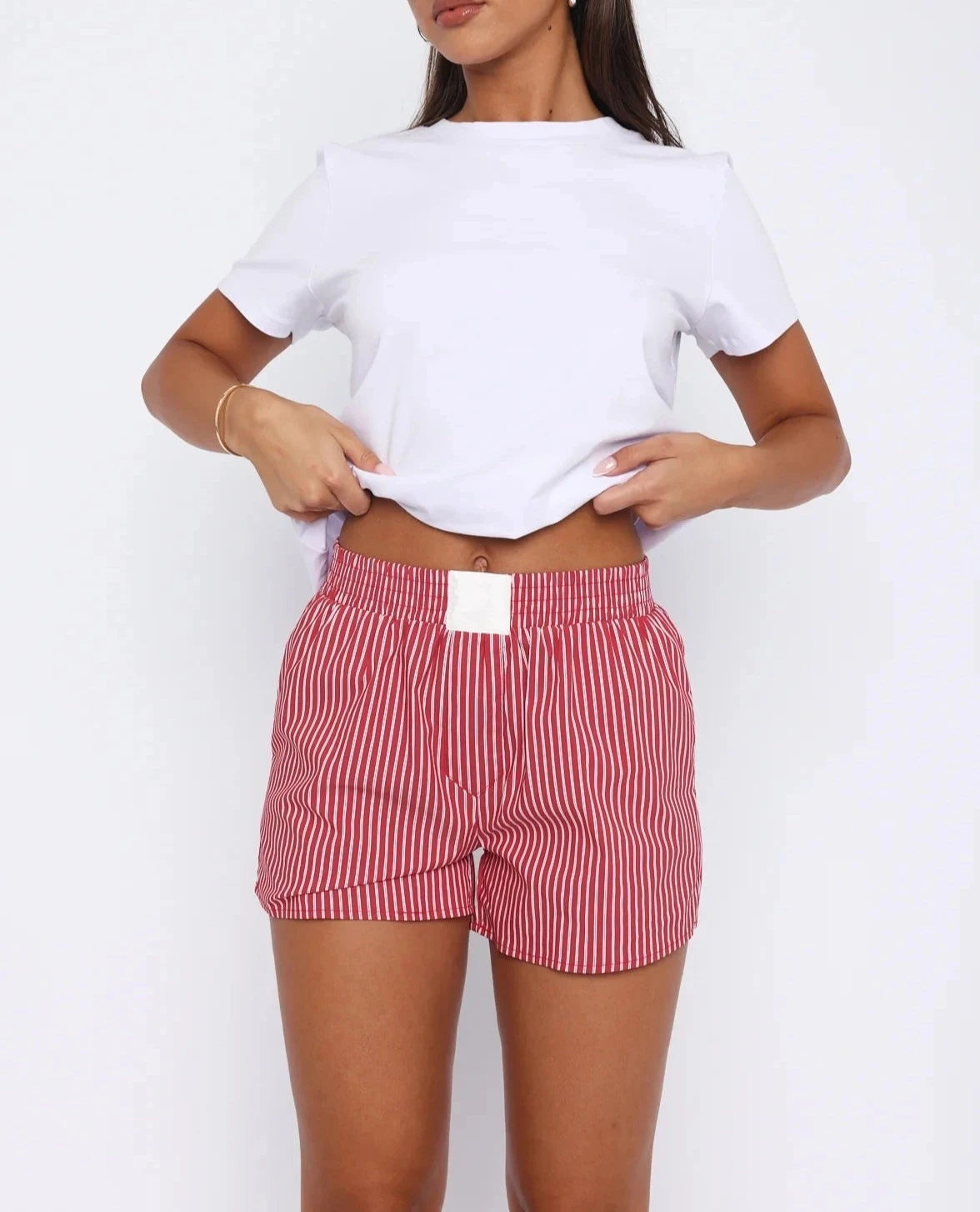 Loose High-Waist Casual Shorts made from cotton and polyester broadcloth with an elastic waist and solid pattern, perfect for summer casual wear.
