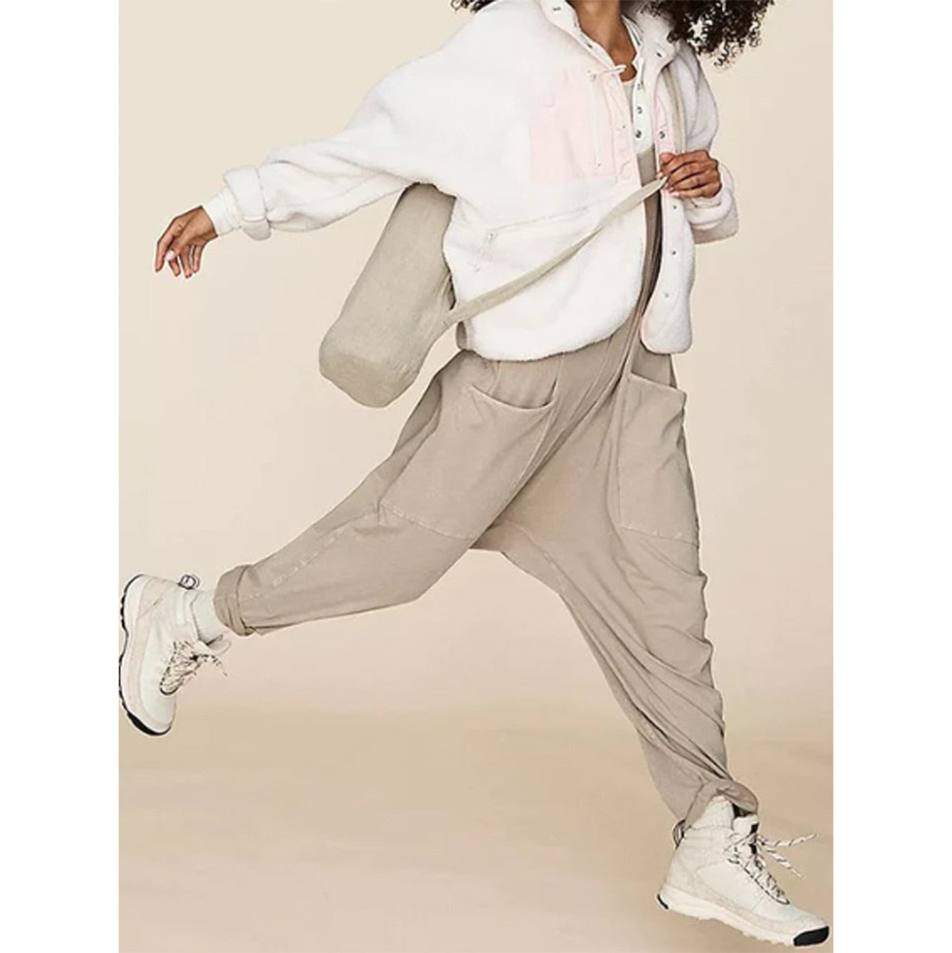 Women's Wide Leg Jumpsuit in solid patterns, loose fit, with pockets. Perfect for summer fashion. Available for women aged 18-24. Made from premium polyester fabric.