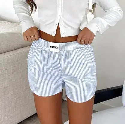 Loose High-Waist Casual Shorts made from cotton and polyester broadcloth with an elastic waist and solid pattern, perfect for summer casual wear.