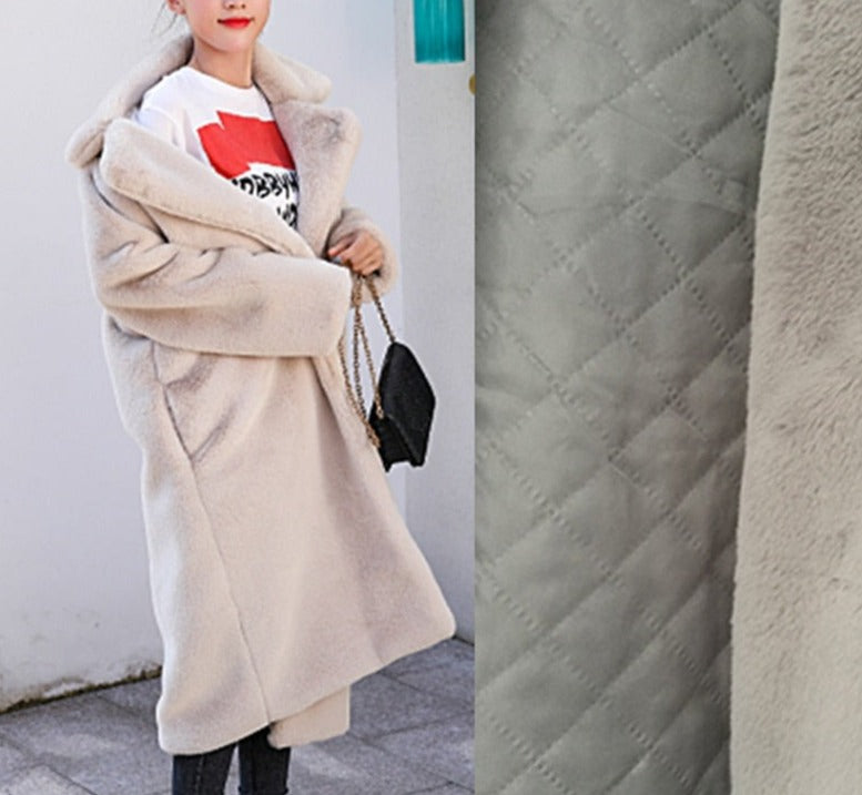 Stylish and warm fur coat with rabbit fur and faux fur for cozy winter wear.