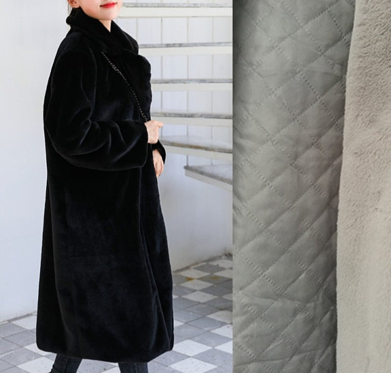 Stylish and warm fur coat with rabbit fur and faux fur for cozy winter wear.