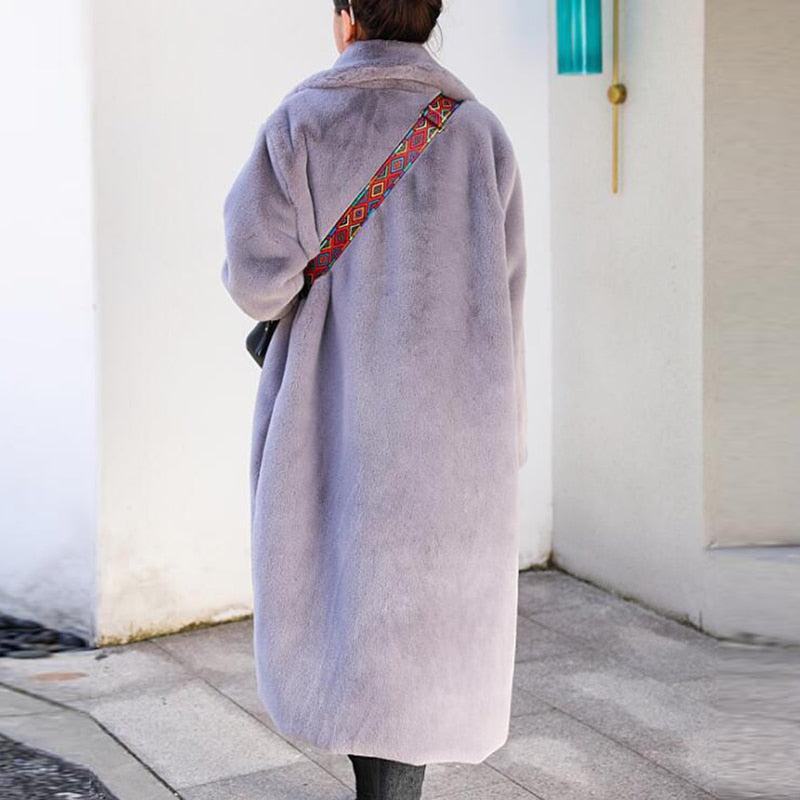 Stylish and warm fur coat with rabbit fur and faux fur for cozy winter wear.