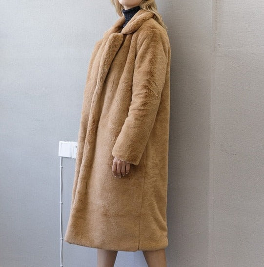 Stylish and warm fur coat with rabbit fur and faux fur for cozy winter wear.