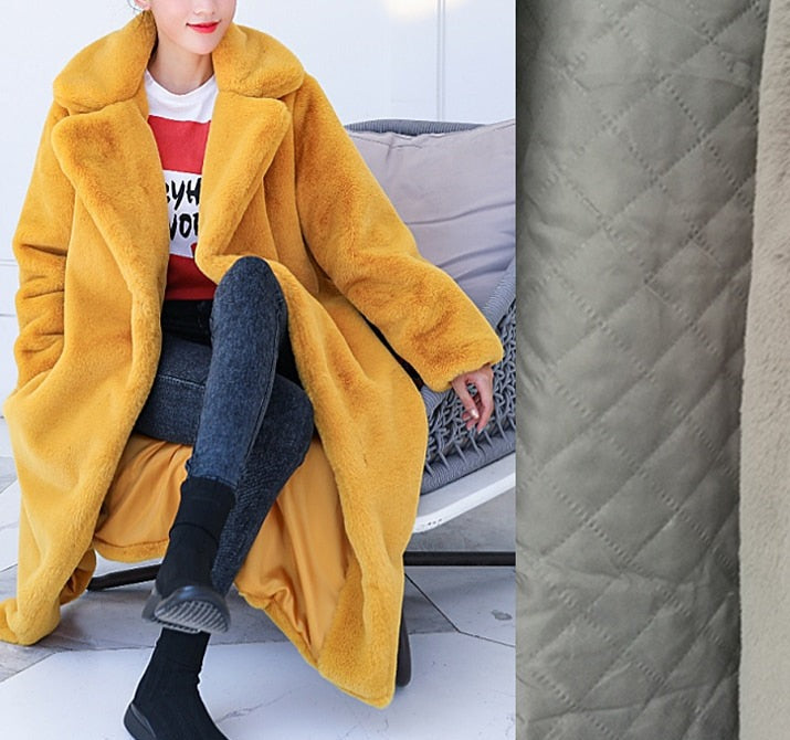 Stylish and warm fur coat with rabbit fur and faux fur for cozy winter wear.