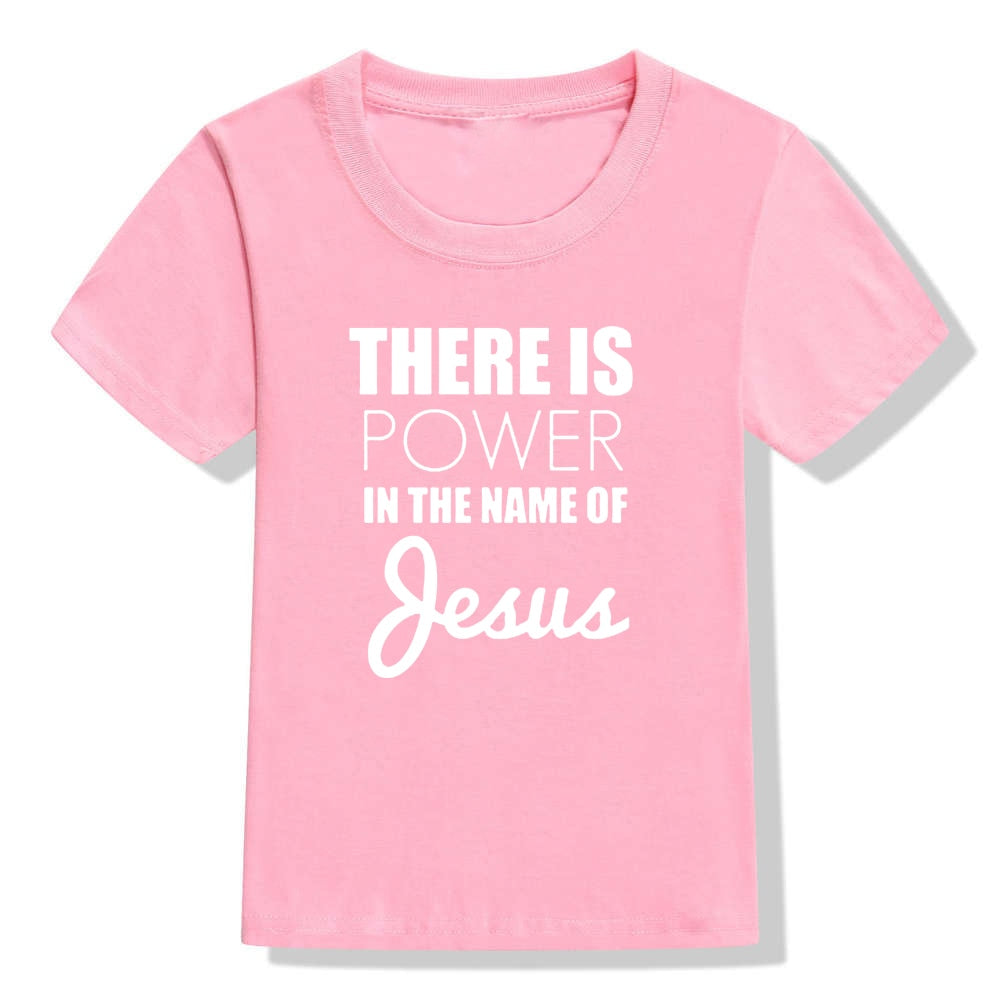 Image of True Radiant Treasures' There Is Power In The Name of Jesus Kid's T-Shirt made from 100% polyester. The comfortable and durable t-shirt is perfect for boys and girls alike, with a round neck and short sleeves. Let your child show their religious pride in style with this stylish t-shirt.
