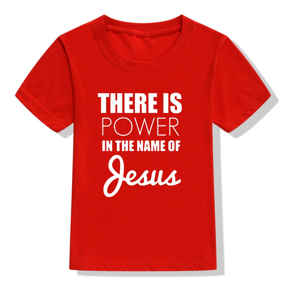 Image of True Radiant Treasures' There Is Power In The Name of Jesus Kid's T-Shirt made from 100% polyester. The comfortable and durable t-shirt is perfect for boys and girls alike, with a round neck and short sleeves. Let your child show their religious pride in style with this stylish t-shirt.