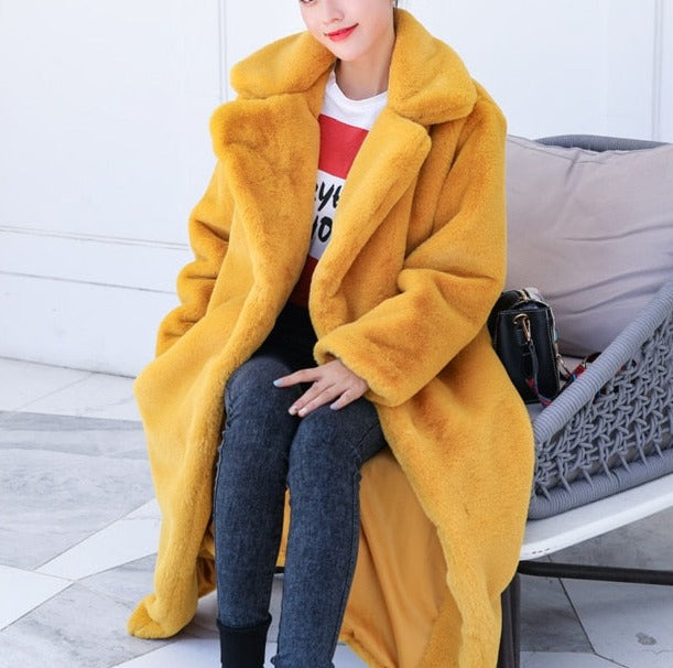 Stylish and warm fur coat with rabbit fur and faux fur for cozy winter wear.