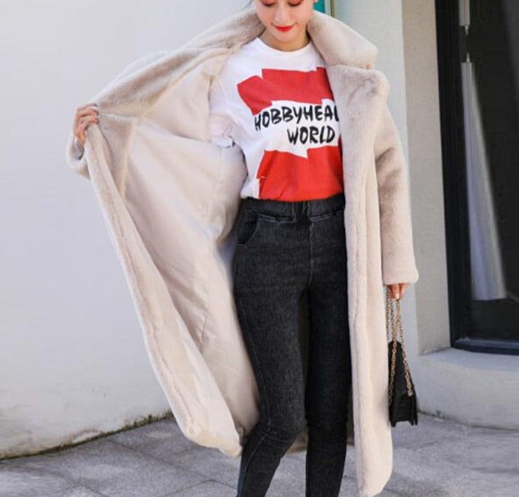 Stylish and warm fur coat with rabbit fur and faux fur for cozy winter wear.