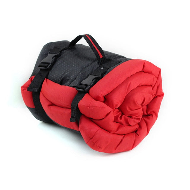 Image of Portable Waterproof Dog Bed - Travel-friendly and durable, ideal for camping, hiking, and road trips. Waterproof microtomic ripstop top with non-slip Rufftex bottom. Easily rolls up for storage with a handle for transport. Available in Medium (27" x 36" x 2") and Large (36" x 48" x 3") sizes. Weighs 2.2 pounds (Medium) and 3.7 pounds (Large). Hand wash or machine wash gentle cycle. Hang dry.