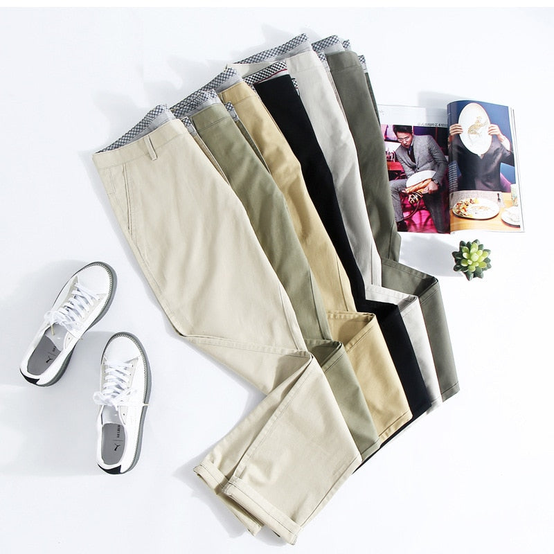 A pair of stylish trousers with a unique shirt gripper feature, designed to keep your shirt in place. Versatile for any occasion, featuring a stretch waistband for comfort.