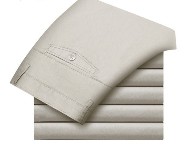 A pair of stylish trousers with a unique shirt gripper feature, designed to keep your shirt in place. Versatile for any occasion, featuring a stretch waistband for comfort.