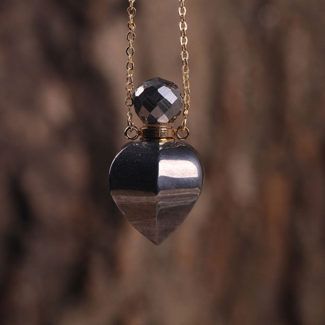 Heart-shaped Gold Silvery Necklace with treated rose quartz stone - A versatile and elegant accessory for women, promoting emotional bonding and desire.