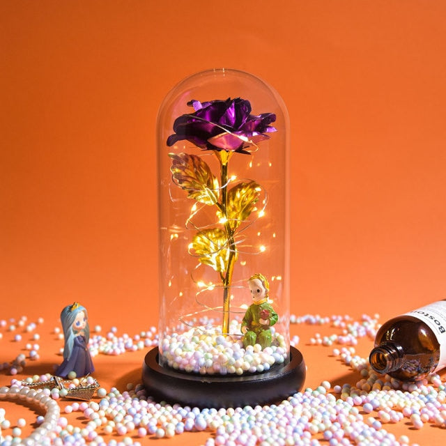 Artificial galaxy rose flowers in glass dome with LED lighting on black wood base, perfect for home decor or romantic gift for Valentine's Day, weddings. or any special occasion.