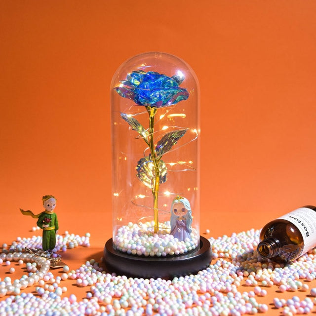 Artificial galaxy rose flowers in glass dome with LED lighting on black wood base, perfect for home decor or romantic gift for Valentine's Day, weddings. or any special occasion.