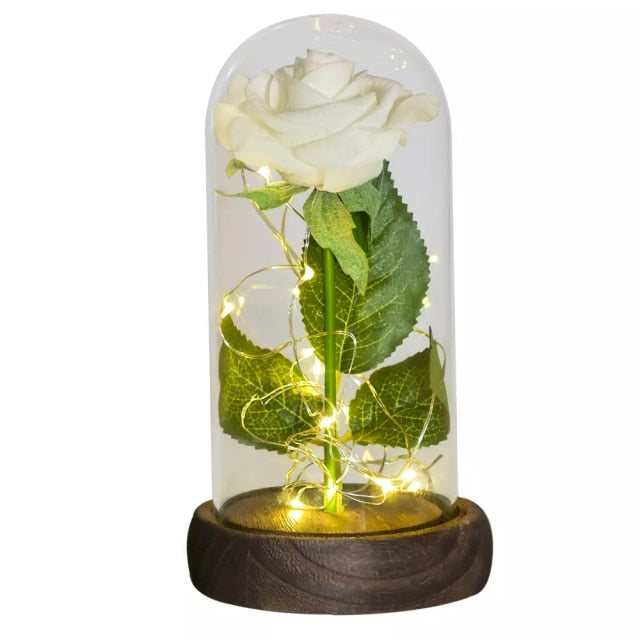 Artificial galaxy rose flowers in glass dome with LED lighting on black wood base, perfect for home decor or romantic gift for Valentine's Day, weddings. or any special occasion.