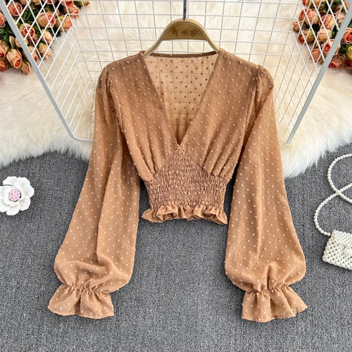 Stylish Long Sleeve Crop Top with polka dot pattern made of silk, cotton, and spandex. Comes with a matching attached tank top for versatile styling.