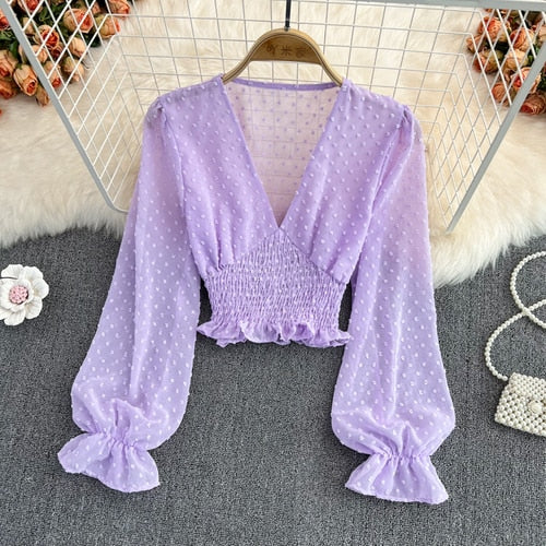 Stylish Long Sleeve Crop Top with polka dot pattern made of silk, cotton, and spandex. Comes with a matching attached tank top for versatile styling.