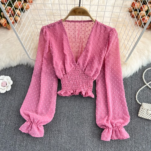 Stylish Long Sleeve Crop Top with polka dot pattern made of silk, cotton, and spandex. Comes with a matching attached tank top for versatile styling.