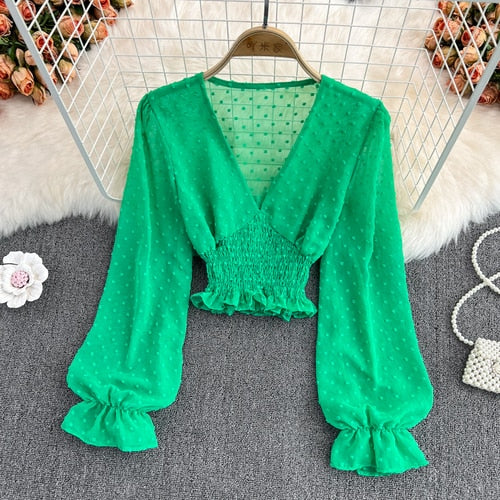 Stylish Long Sleeve Crop Top with polka dot pattern made of silk, cotton, and spandex. Comes with a matching attached tank top for versatile styling.