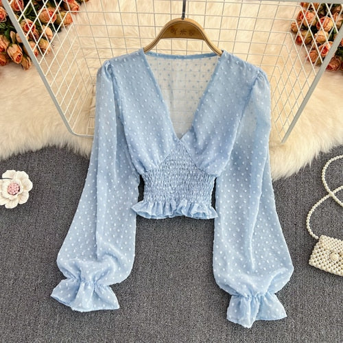 Stylish Long Sleeve Crop Top with polka dot pattern made of silk, cotton, and spandex. Comes with a matching attached tank top for versatile styling.