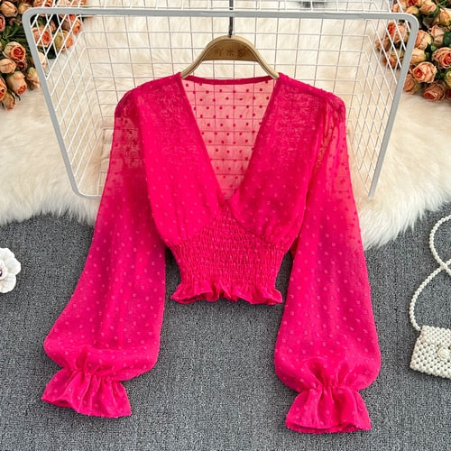 Stylish Long Sleeve Crop Top with polka dot pattern made of silk, cotton, and spandex. Comes with a matching attached tank top for versatile styling.