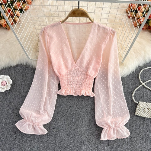 Stylish Long Sleeve Crop Top with polka dot pattern made of silk, cotton, and spandex. Comes with a matching attached tank top for versatile styling.